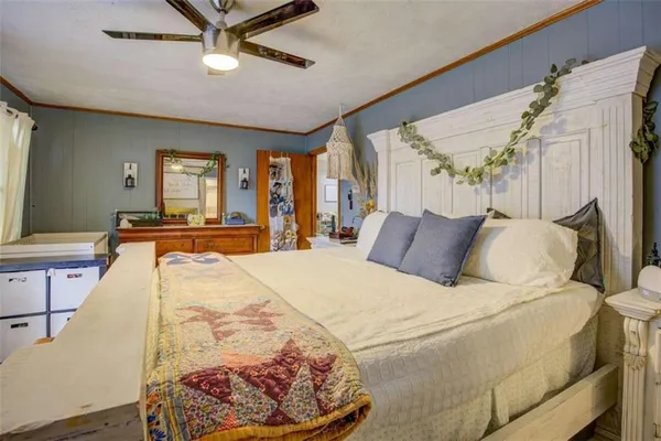 a bed room with a bed and a flat screen tv