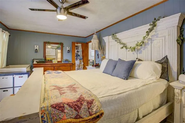 a bed room with a bed and a flat screen tv