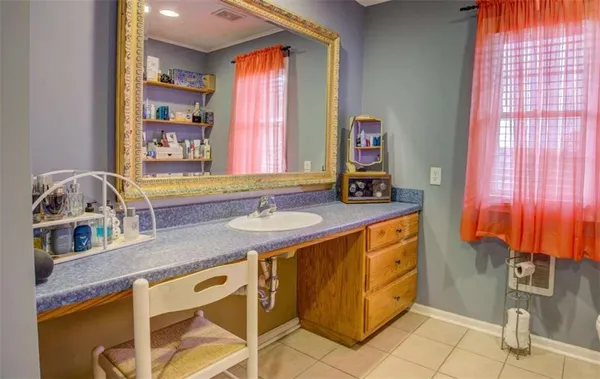 a bathroom with a sink and a mirror