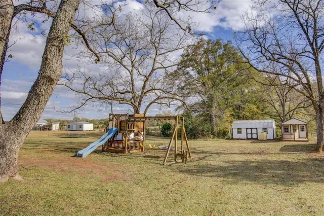 a view of a house with a snow in a yard