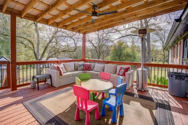 a dining room with furniture and wooden floor