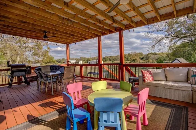 a view of a yard with wooden fence