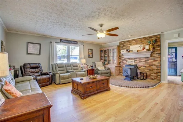 a living room with fireplace furniture and a flat screen tv