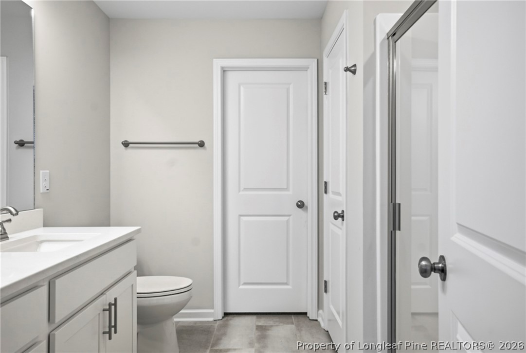 106 Knotts Berry Road Bunnlevel, NC 28323 - Photo 27 of 50 a bathroom with a sink a toilet and shower
