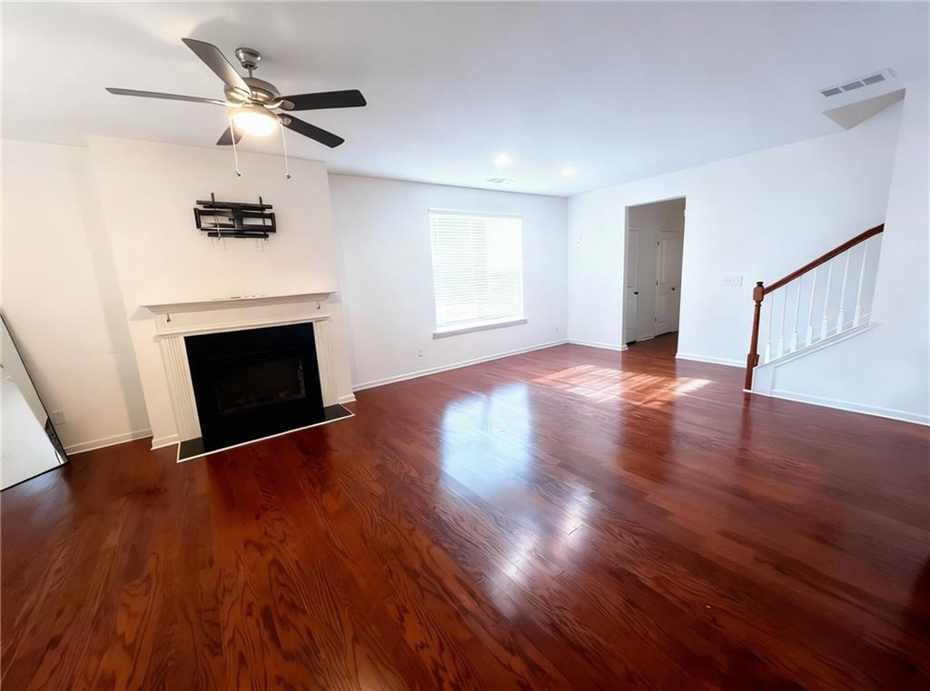 602 Lofty Lane Atlanta, GA 30331 - Photo 11 of 38 a view of an empty room with wooden floor fireplace and a window