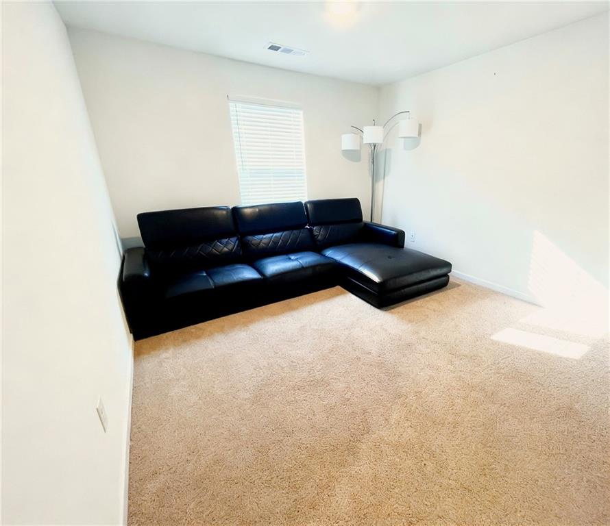 602 Lofty Lane Atlanta, GA 30331 - Photo 14 of 38 a living room with a couch and a potted plant