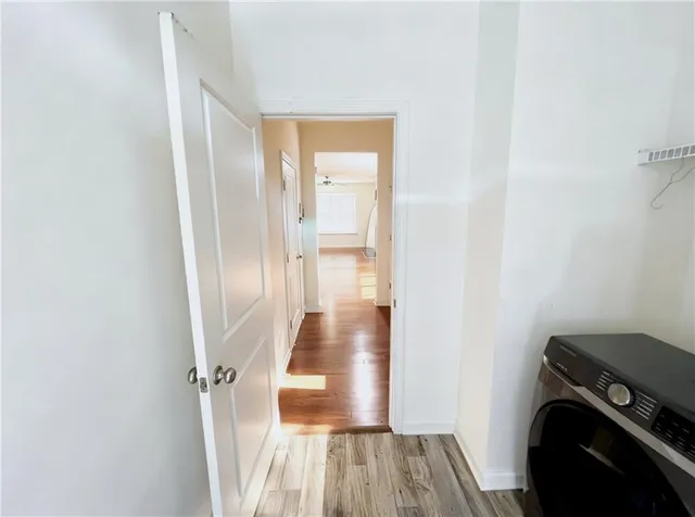 a bedroom with a bed dresser and a window