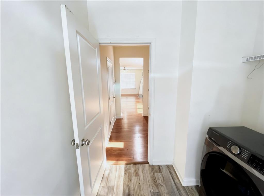 602 Lofty Lane Atlanta, GA 30331 - Photo 17 of 38 a view of a hallway with wooden floor and a bathroom