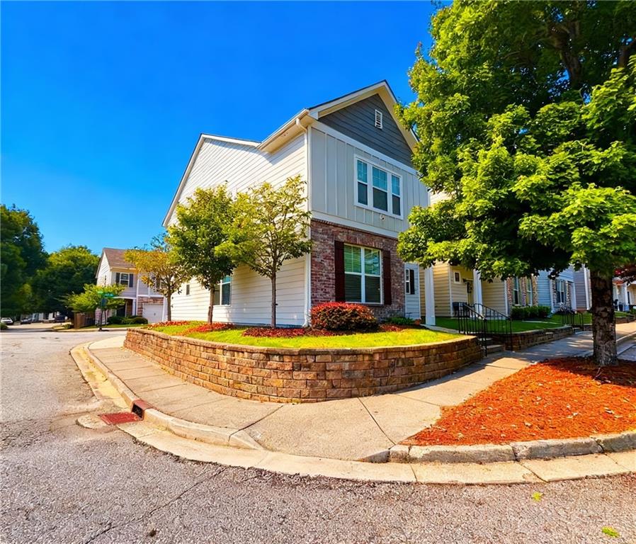 602 Lofty Lane Atlanta, GA 30331 - Photo 2 of 38 a view of a white house with a swimming pool and sitting area