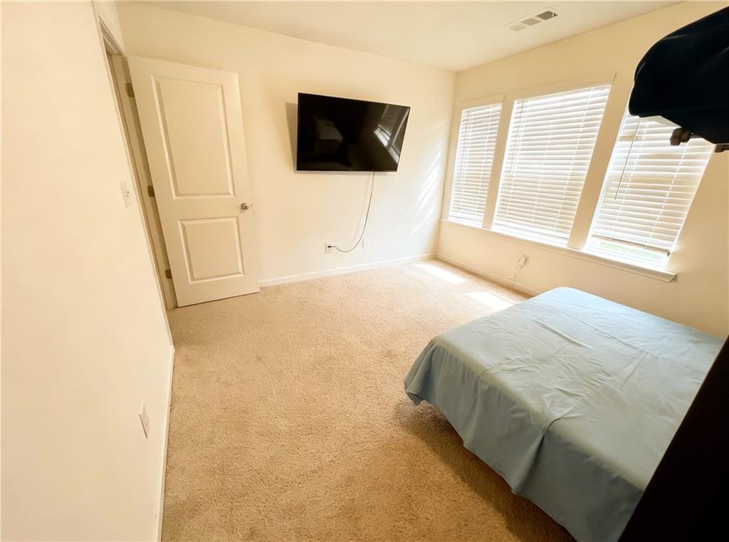 602 Lofty Lane Atlanta, GA 30331 - Photo 23 of 38 a bedroom with a bed and a flat screen tv