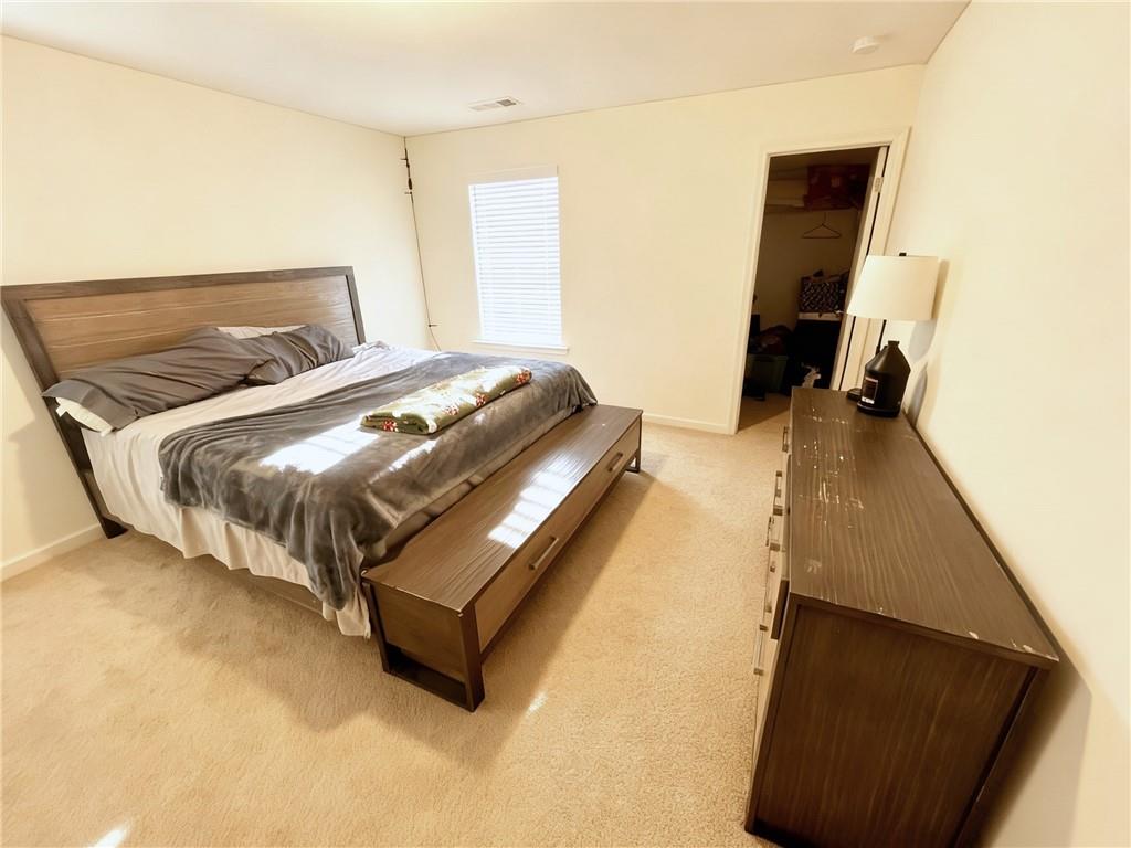 602 Lofty Lane Atlanta, GA 30331 - Photo 30 of 38 a bedroom with a bed and a dresser