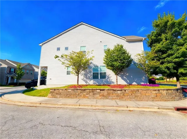 a front view of a house with a yard