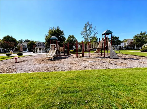 a view of a garden with houses