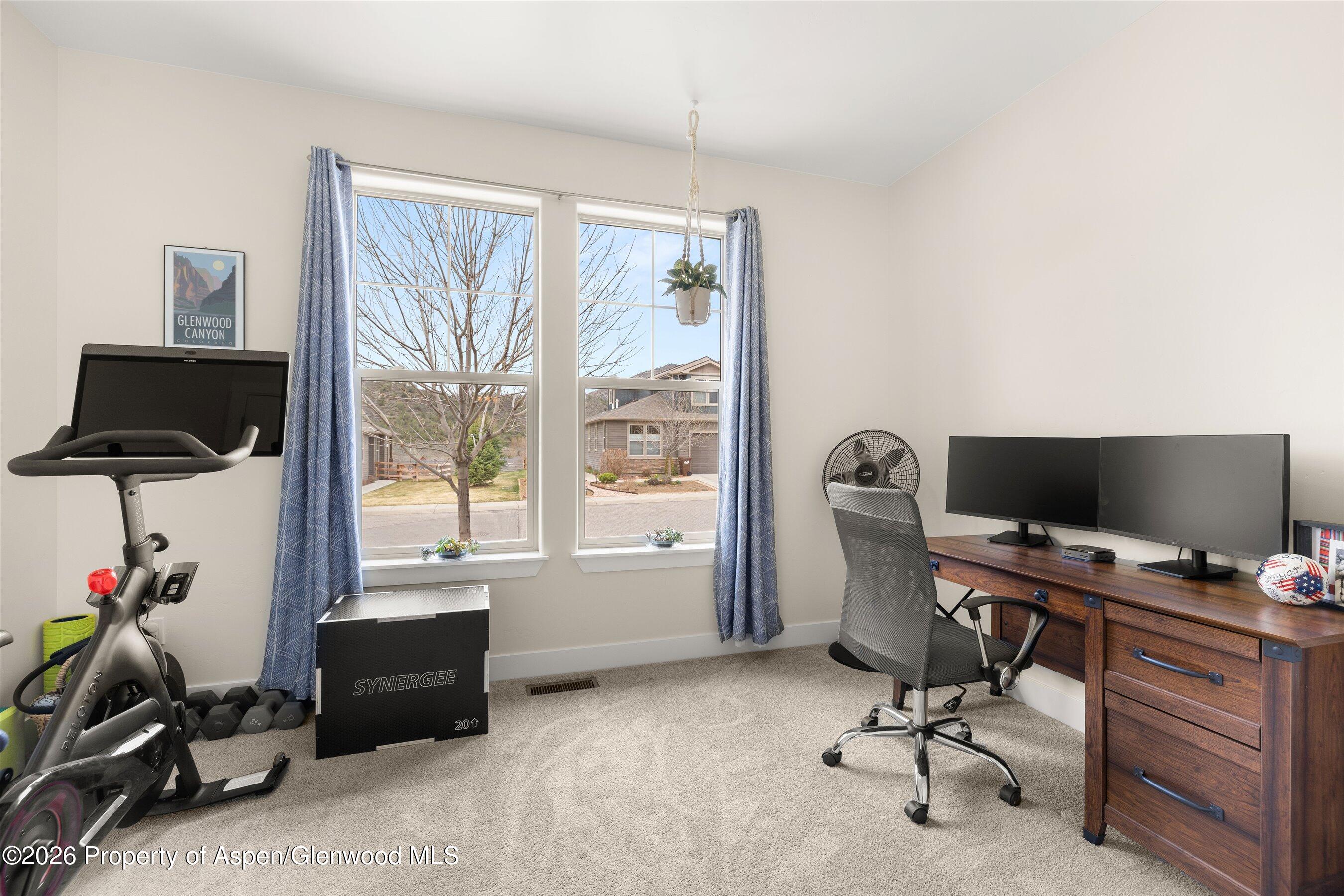 114 Redstone Drive New Castle, CO 81647 - Photo 12 of 20 a view of a workspace with furniture and a window