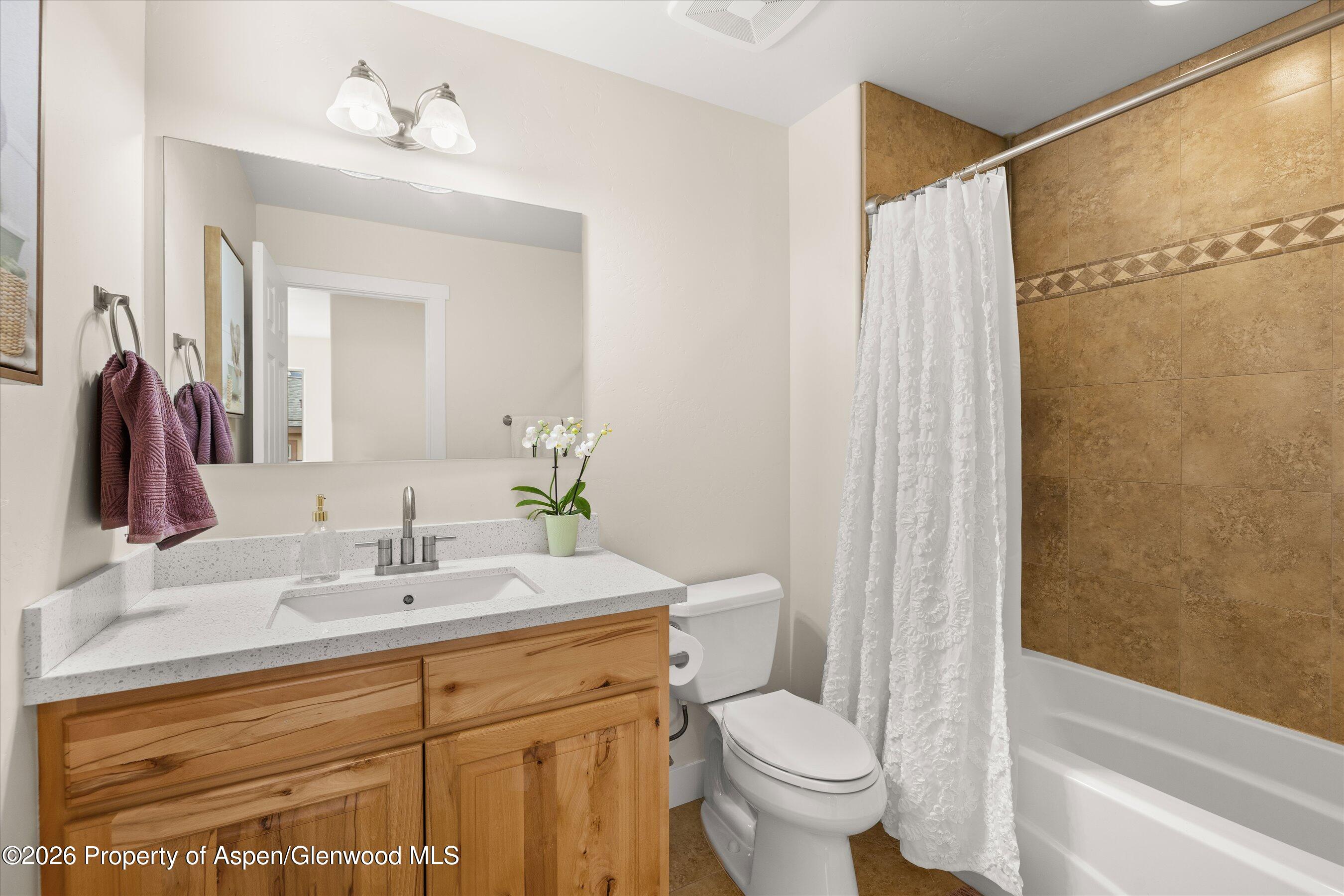 114 Redstone Drive New Castle, CO 81647 - Photo 14 of 20 a bathroom with a sink toilet and shower