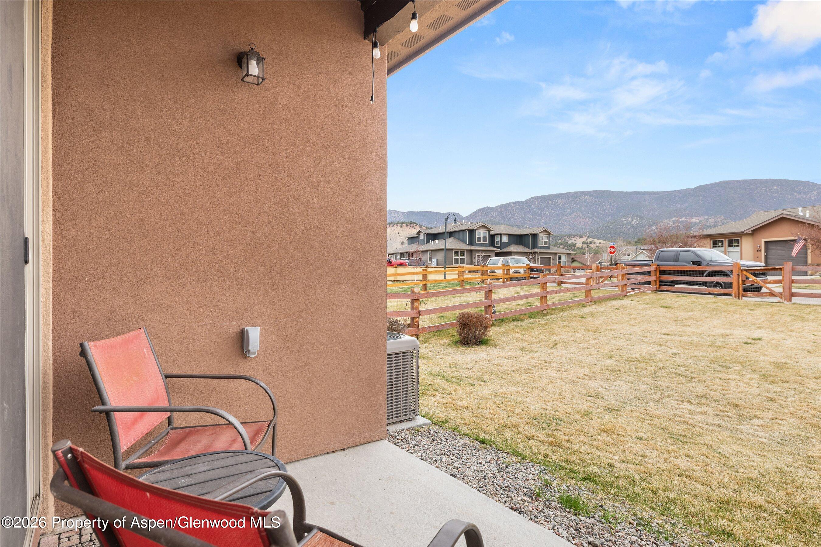 114 Redstone Drive New Castle, CO 81647 - Photo 17 of 20 a view of a terrace with chairs and a stove