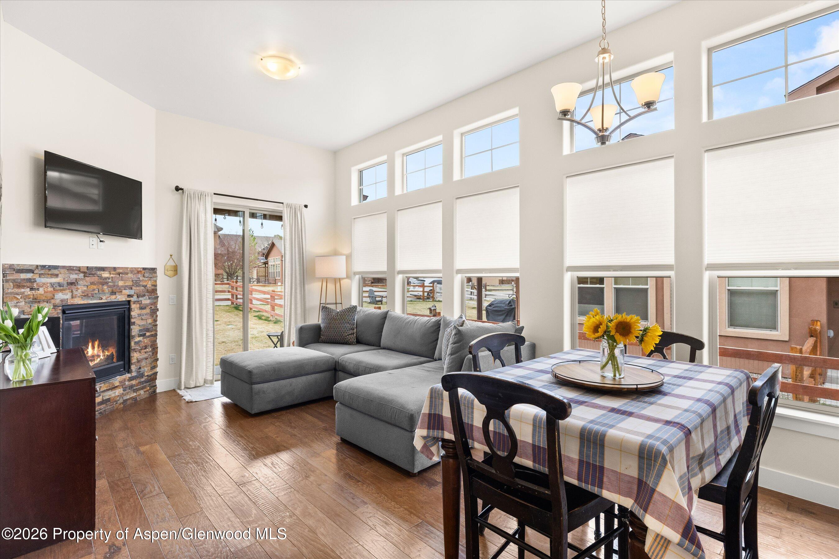 114 Redstone Drive New Castle, CO 81647 - Photo 2 of 20 a living room with furniture fireplace and a flat screen tv