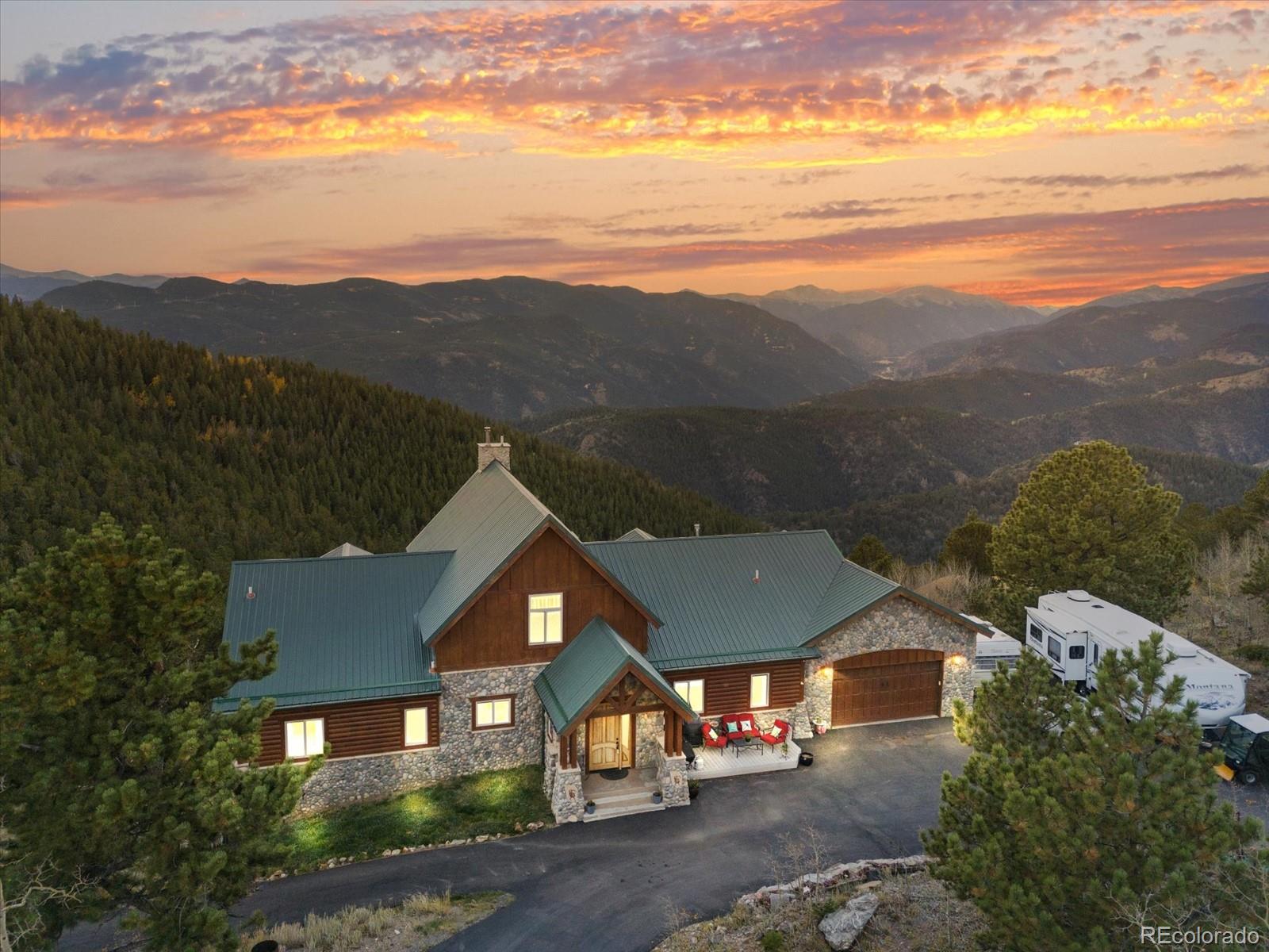an aerial view of a house with mountain view