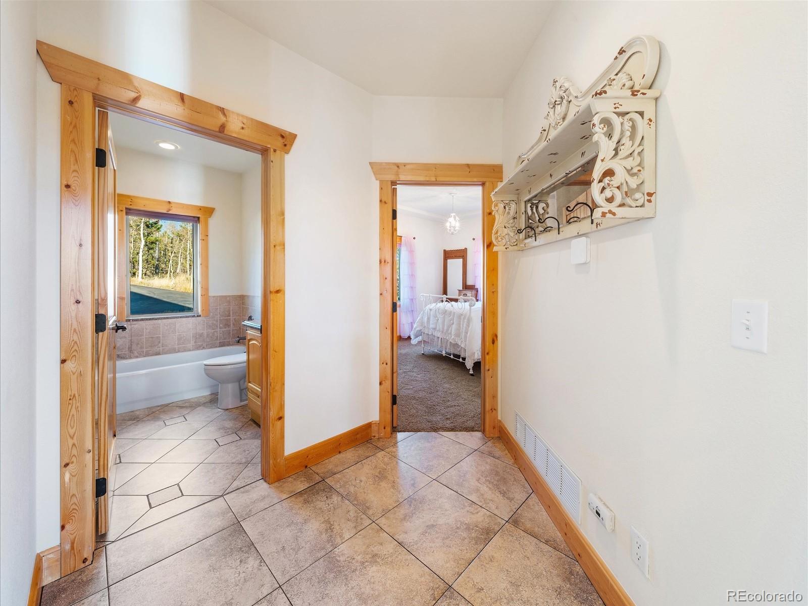 479 Dakota Ridge Road Idaho Springs, CO 80452 - Photo 22 of 50 a view of a bathroom from a hallway