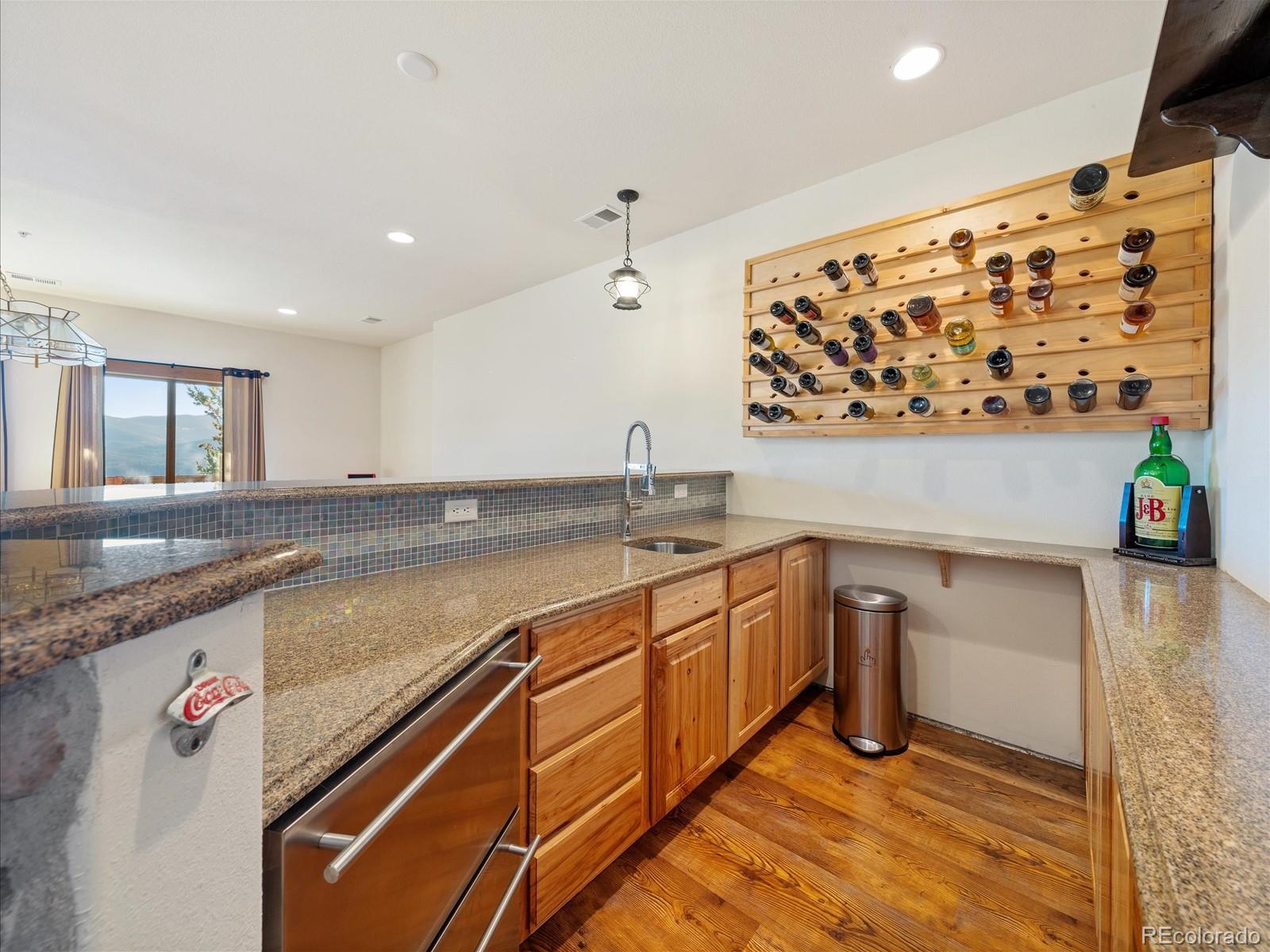 479 Dakota Ridge Road Idaho Springs, CO 80452 - Photo 39 of 50 a spacious bathroom with a granite countertop sink and a bathtub