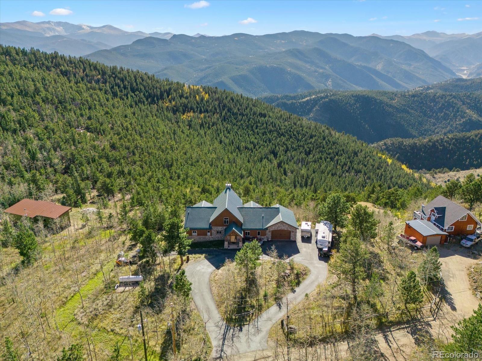479 Dakota Ridge Road Idaho Springs, CO 80452 - Photo 46 of 50 a view of a house with a yard