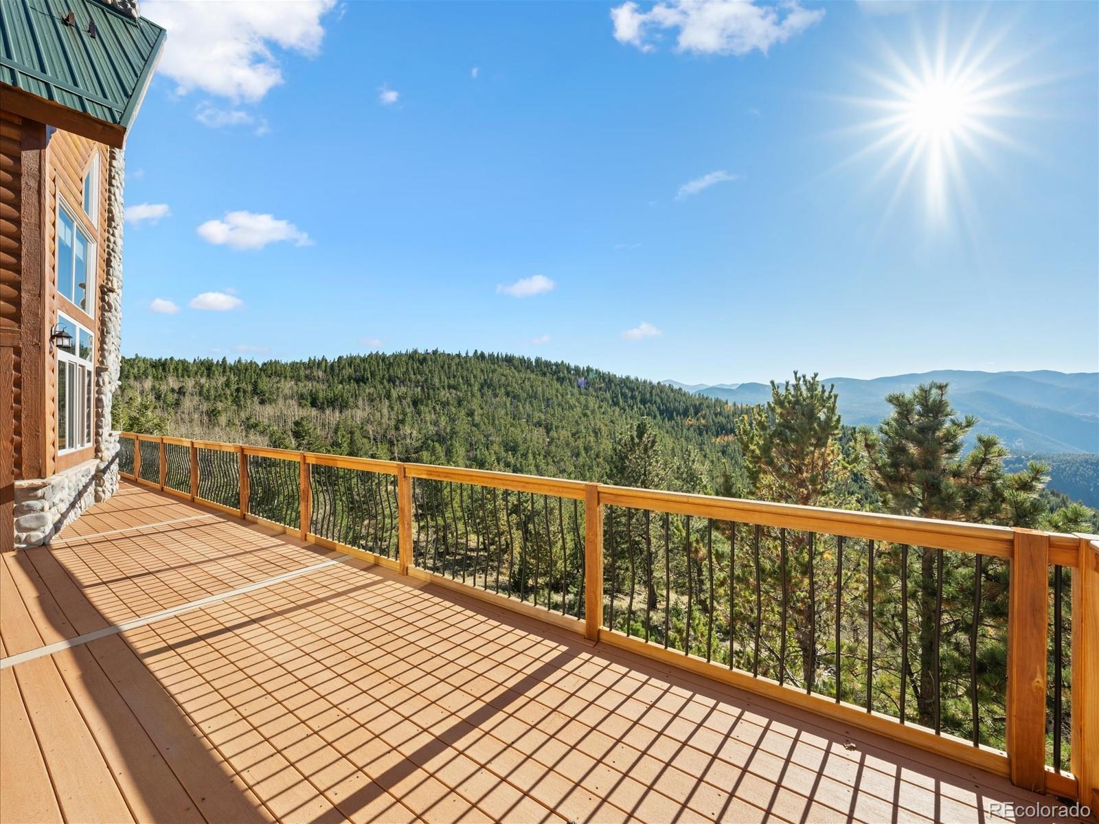 479 Dakota Ridge Road Idaho Springs, CO 80452 - Photo 5 of 50 a view of balcony with wooden floor and fence