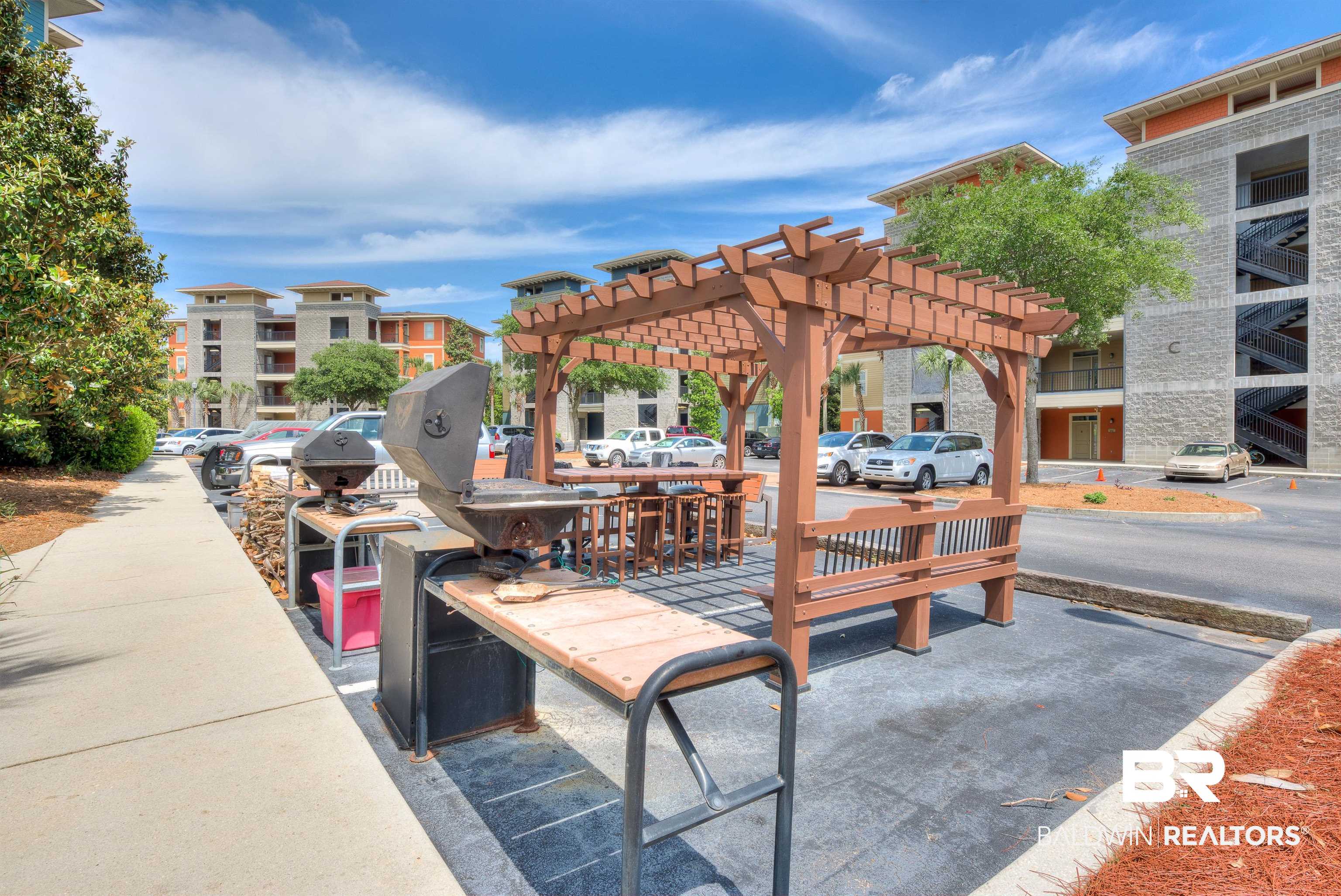 1430 Regency Road, Unit A301 Gulf Shores, AL 36542 - Photo 46 of 47 View of patio with a balcony and a pergola