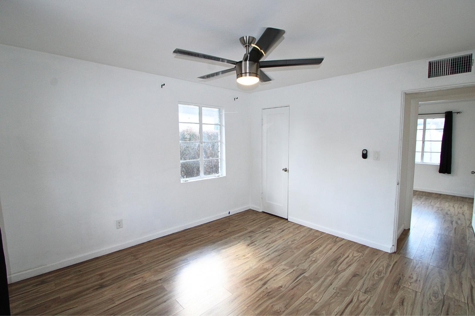 4212 North 19th Street, Unit A Phoenix, AZ 85016 - Photo 12 of 15 wooden floor in an empty room with a window