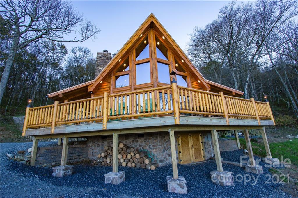 a view of a house with wooden deck
