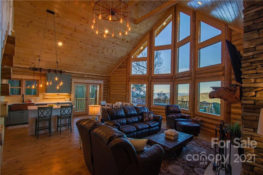 147 North Chappell Road, Unit 3 Banner Elk, NC 28604 - Photo 13 of 43 a living room with furniture a large window and a table