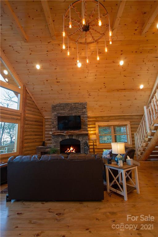 147 North Chappell Road, Unit 3 Banner Elk, NC 28604 - Photo 15 of 43 a living room with furniture a flat screen tv and kitchen view
