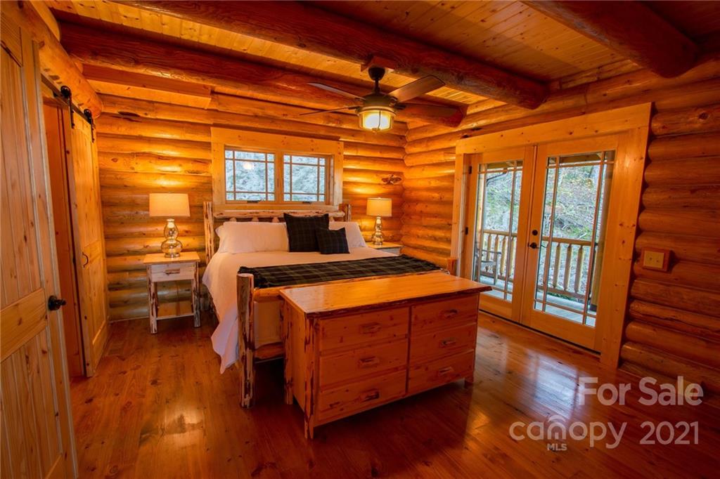 147 North Chappell Road, Unit 3 Banner Elk, NC 28604 - Photo 16 of 43 a bedroom with a bed and wooden floor