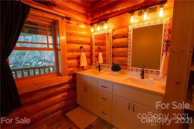 147 North Chappell Road, Unit 3 Banner Elk, NC 28604 - Photo 19 of 43 a bathroom with a double vanity sink and a large mirror