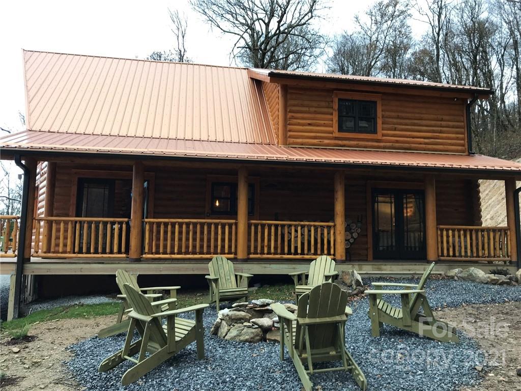147 North Chappell Road, Unit 3 Banner Elk, NC 28604 - Photo 3 of 43 a view of a house with a wooden deck and furniture