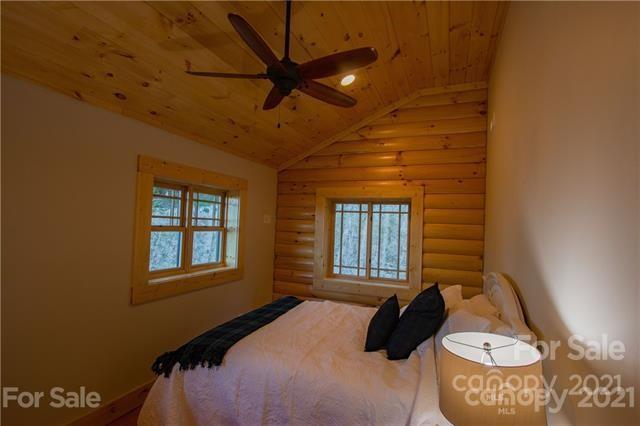 147 North Chappell Road, Unit 3 Banner Elk, NC 28604 - Photo 23 of 43 a bedroom with a bed a dresser and window