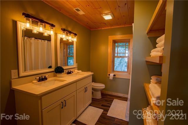147 North Chappell Road, Unit 3 Banner Elk, NC 28604 - Photo 25 of 43 a bathroom with a sink and a mirror