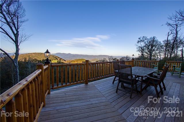 147 North Chappell Road, Unit 3 Banner Elk, NC 28604 - Photo 28 of 43 a view of a roof deck with table and chairs and wooden floor