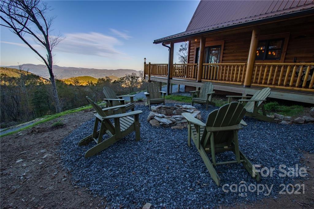 147 North Chappell Road, Unit 3 Banner Elk, NC 28604 - Photo 35 of 43 a view of a house with backyard wooden deck and sitting area