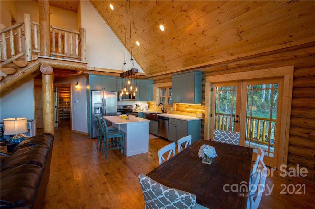 147 North Chappell Road, Unit 3 Banner Elk, NC 28604 - Photo 9 of 43 a living room with stainless steel appliances furniture a rug and a view of kitchen