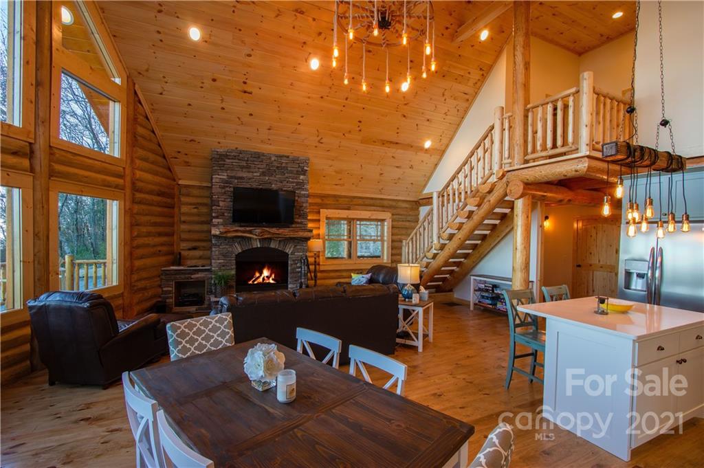 147 North Chappell Road, Unit 3 Banner Elk, NC 28604 - Photo 10 of 43 a living room with fireplace furniture and a flat screen tv
