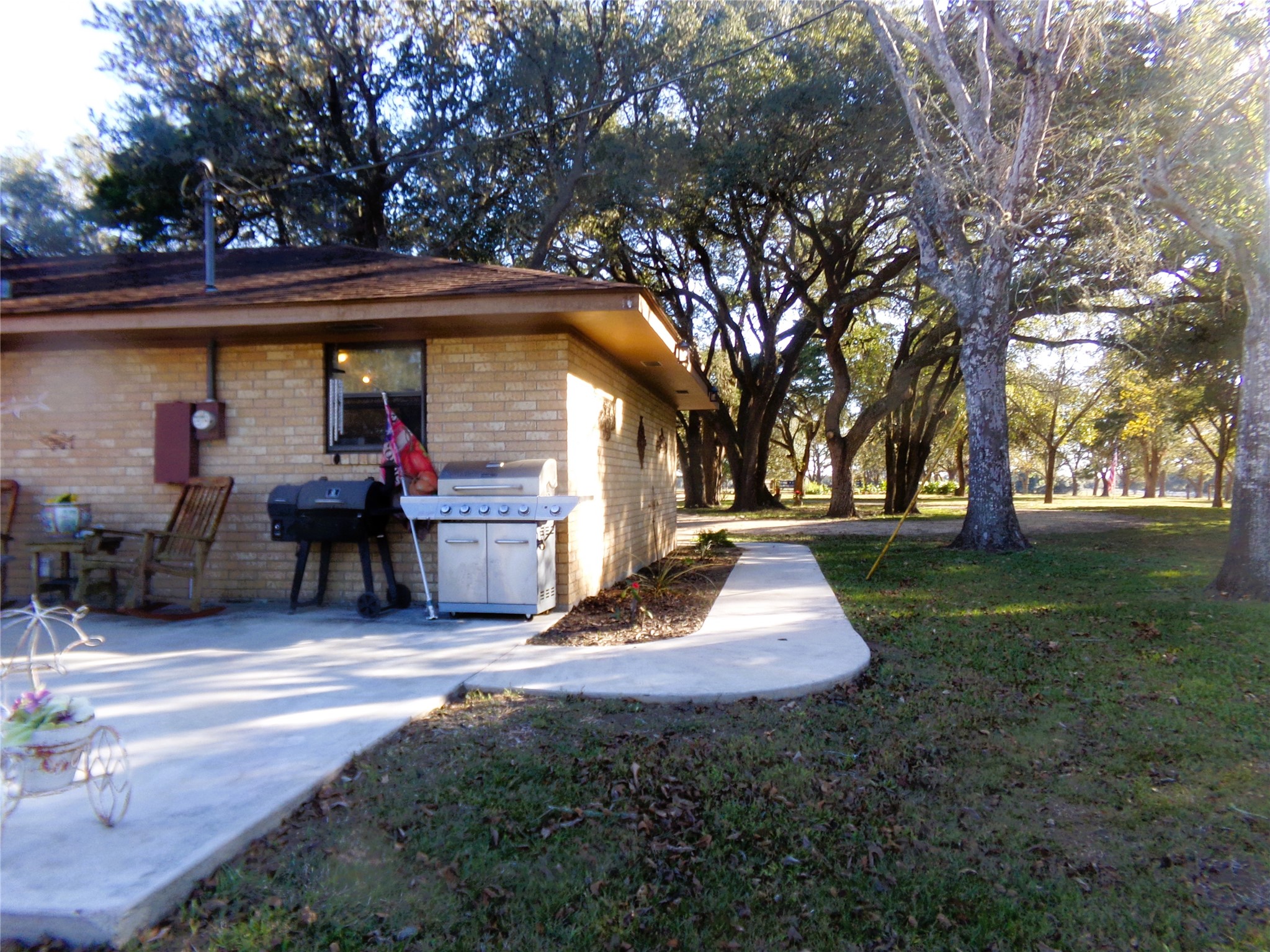 1017 County Road 285 Weimar, TX 78962 - Photo 13 of 18 a view of a house with backyard and trees