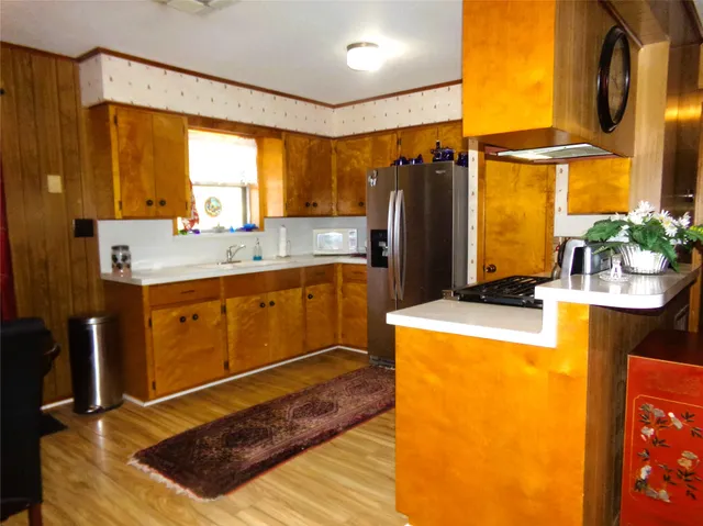 a view of a dining room with furniture and window