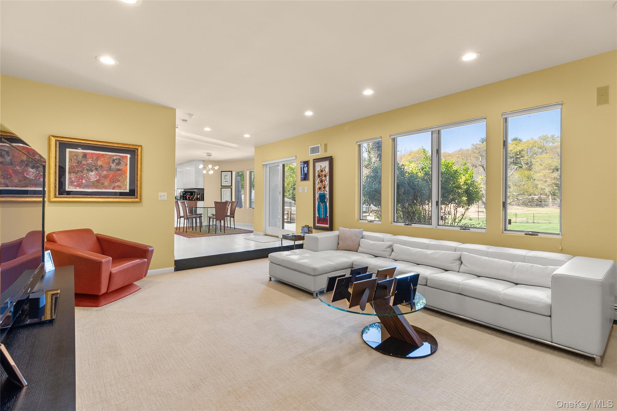 379 Smith Road Ronkonkoma, NY 11779 - Photo 12 of 38 a living room with furniture and a large window