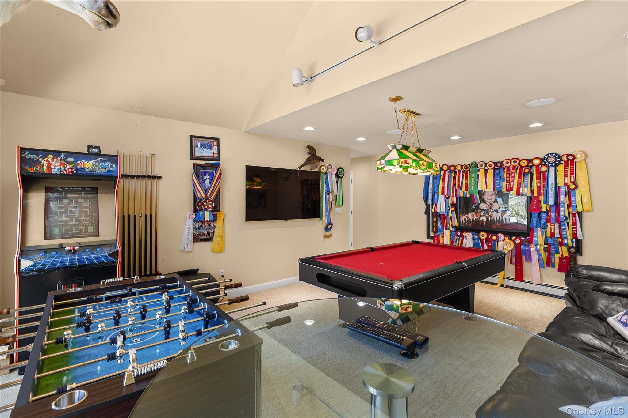 379 Smith Road Ronkonkoma, NY 11779 - Photo 16 of 38 a room with furniture and flat screen tv