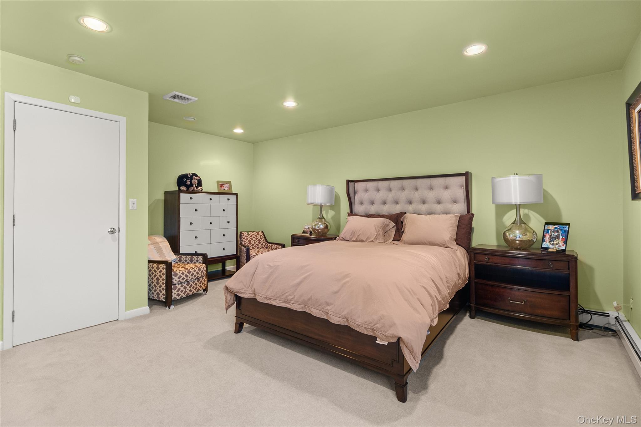 379 Smith Road Ronkonkoma, NY 11779 - Photo 24 of 38 a bedroom with a bed and a desk