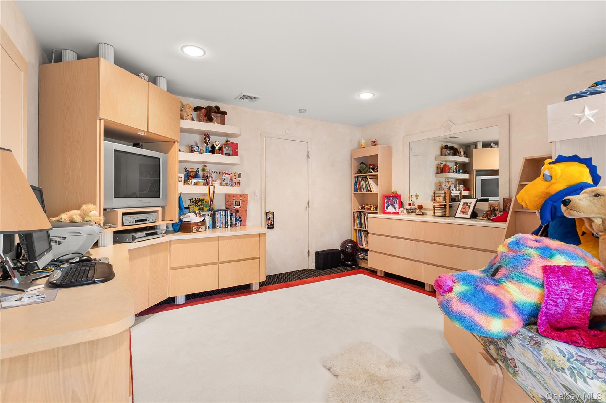 379 Smith Road Ronkonkoma, NY 11779 - Photo 25 of 38 a bedroom with furniture and a flat screen tv