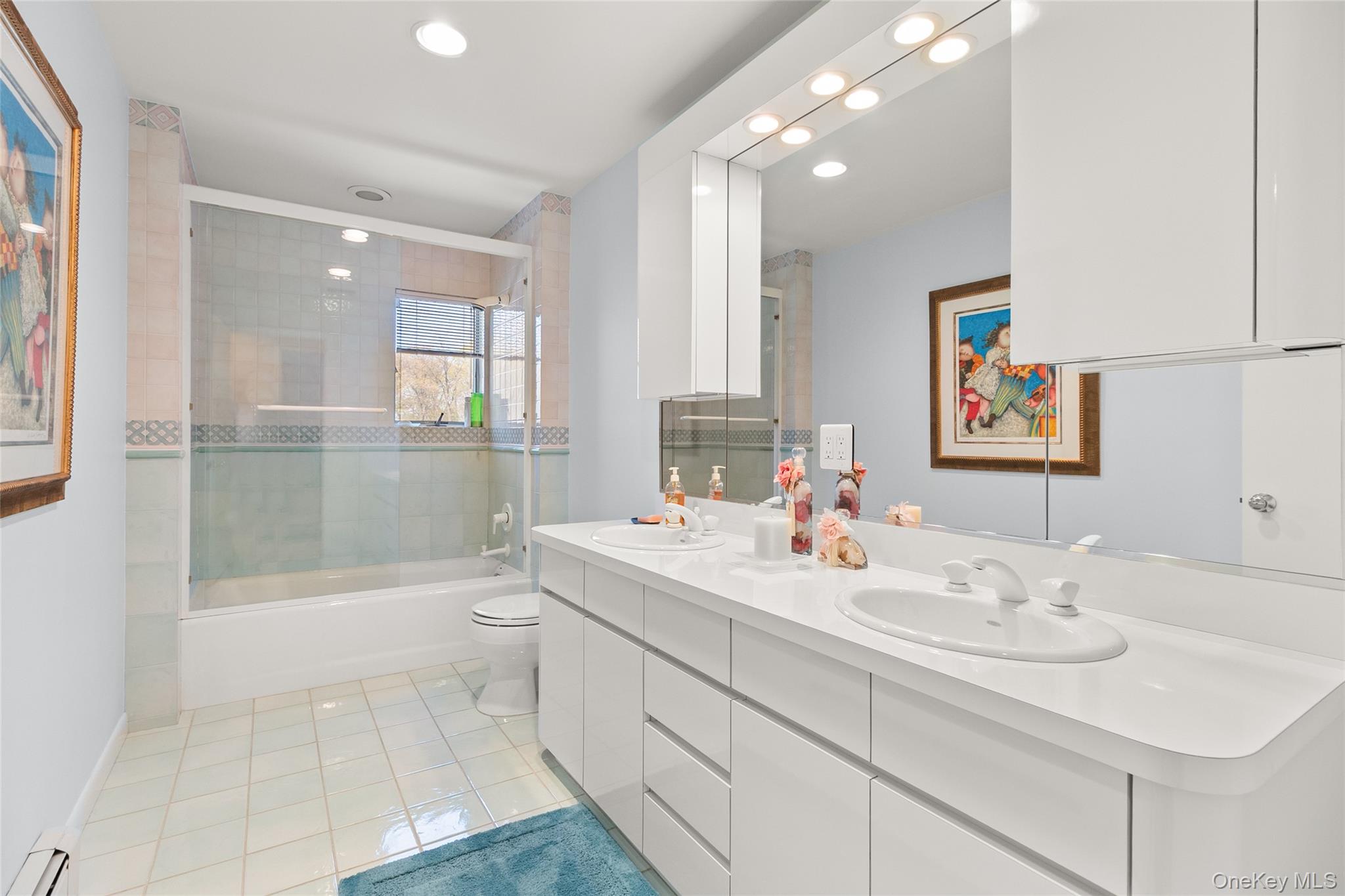 379 Smith Road Ronkonkoma, NY 11779 - Photo 26 of 38 a bathroom with a sink a toilet and shower