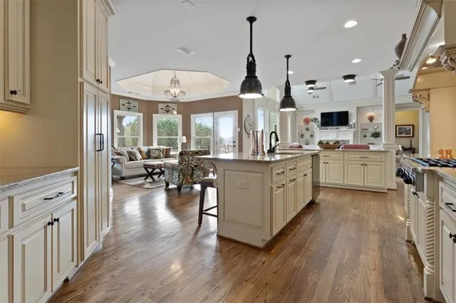 a spacious bathroom with a double vanity sink mirror and bathtub