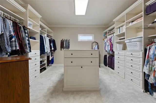 a bedroom with two beds and a chandelier