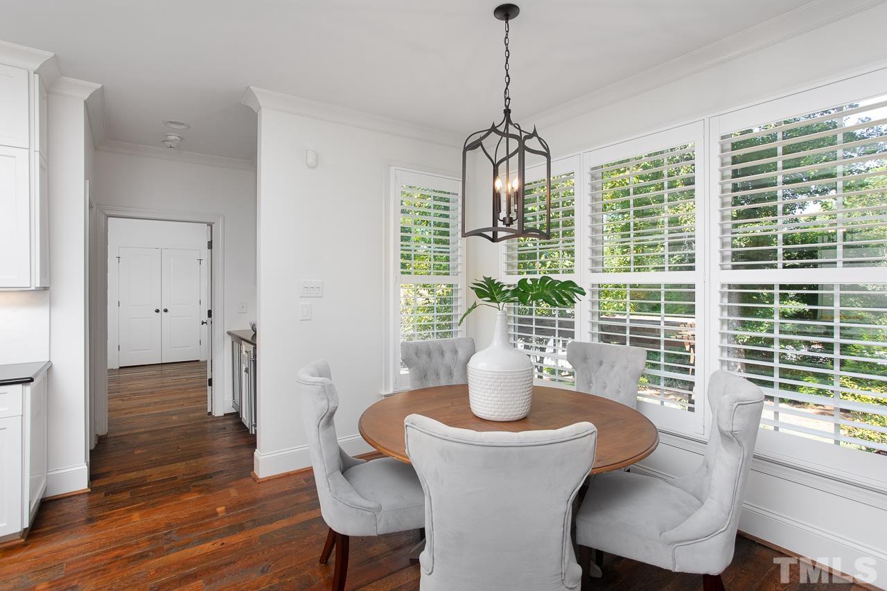 902 Shelley Road Raleigh, NC 27609 - Photo 13 of 45 a view of a dining room with furniture window and wooden floor
